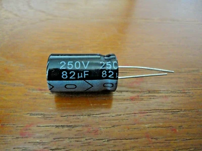 KC ELECTROLYTIC RADIAL 105 CAPACITOR 82MF250V USED IN VARIOUS APPLICATIONS - Image 1 of 2