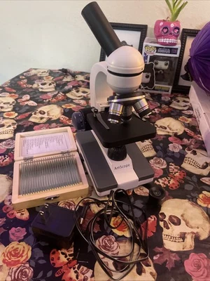 Microscopio compuesto monocular portátil para estudiantes AmScope serie M150  Foto 1 de 4