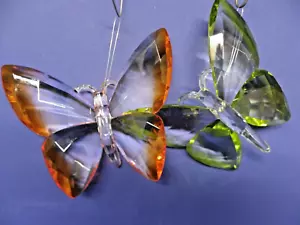Par de mariposas acrílicas gruesas decoración de pared borde verde y naranja de 4" de alto - Imagen 1 de 8