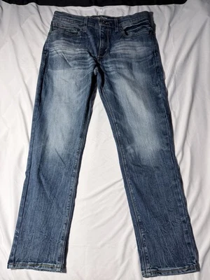 Jeans Denizen Levi’s 216 para hombre W34 L30 calce ajustado tiro bajo lavado azul denim Foto 1 de 4