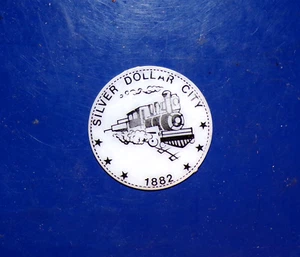 Silver Dollar City 1882 Train / Lady Liberty Plastic Coin or Token - Picture 1 of 2