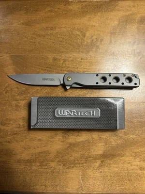 Faca dobrável tática Wartech PWT376GY - Aço inoxidável esqueletizado - 3Cr13 - Imagem 1 de 4