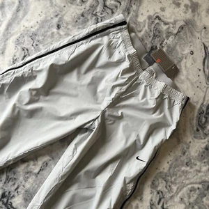 Giacca a vento vintage Deadstock Nike Y2K 2004 pantaloni donna joggers pista corsa M - Foto 1 di 17