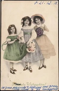 Christmas Postcard by M.M. Vienne ~ Three Beautiful Little Girls Holding Flowers - Picture 1 of 2