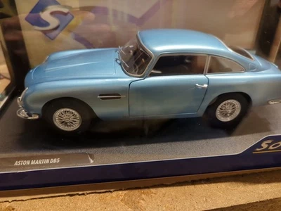 VOITURE SOLIDO ASTON MARTIN DB5 LIGHT METALLIC BLUE 1964  1:18 NEUF.B S1807104 - Photo 1/4