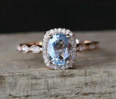 Anillo de compromiso con halo de diamantes aguamarina de corte ovalado de 2 quilates de oro rosa real de 14 quilates Foto 1 de 4