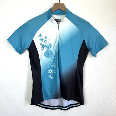 Camisa de ciclismo Novara feminina média azul preta branca 1/2 zíper desempenho - Imagem 1 de 4
