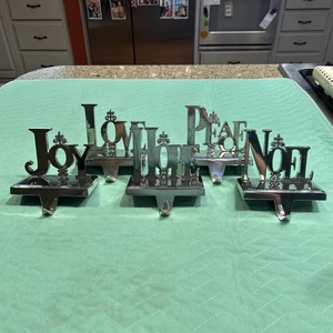 Set Of 5 Silver Weighted Christmas Stocking Hangers EUC Joy Love Hope Peace Noel - Picture 1 of 12