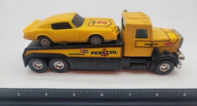 Caminhão de reboque Buddy L Peterbuilt Pennzoil bom ano amarelo com carro - Imagem 1 de 4