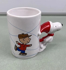 Peanuts Charlie Brown Skating Christmas Snoopy Handle Coffee Cup Mug 50 Years - Picture 1 of 6