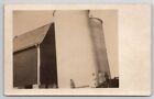RPPC Family Posing With Large Silos And Barn Real Photo Postcard S22