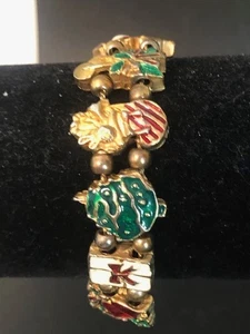Bracciale vintage TOFA con ciondoli scorrevoli 7" vacanze di Natale anni 70 - Foto 1 di 6