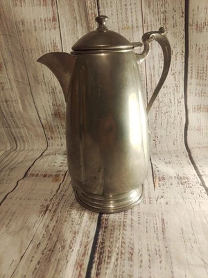 Cafetera o tetera colonial vintage de peltre. Foto 1 de 4