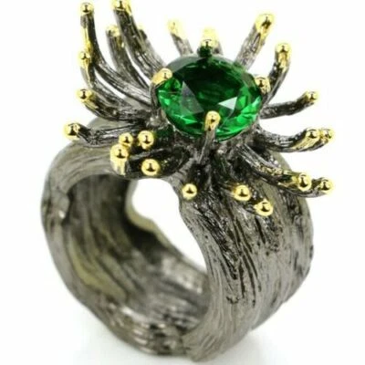 BLACK SILVER AND GOLD RING WITH FUTURISTIC DESIGN EMERALD GREEN STONES - Image 1 of 4