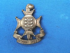 The 5th Battalion ( Cinque Ports ) Royal Sussex Regiment cap badge.