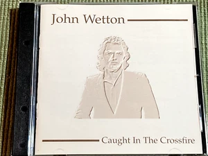 JOHN WETTON CAUGHT IN THE CROSSFIRE RARE GOLD 10 TRACK CD FREE SHIPPING - Picture 1 of 3