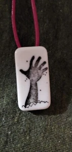 zombie necklace hand out of ground grave dead corpse silhouette rectangle tile  - Picture 1 of 3