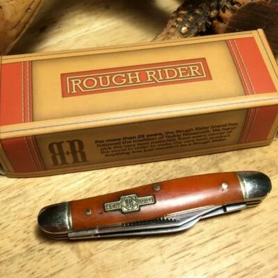 Navaja de bolsillo Rough Rider naranja hueso liso pequeño ganadero 2 3/4" RR244 Foto 1 de 4