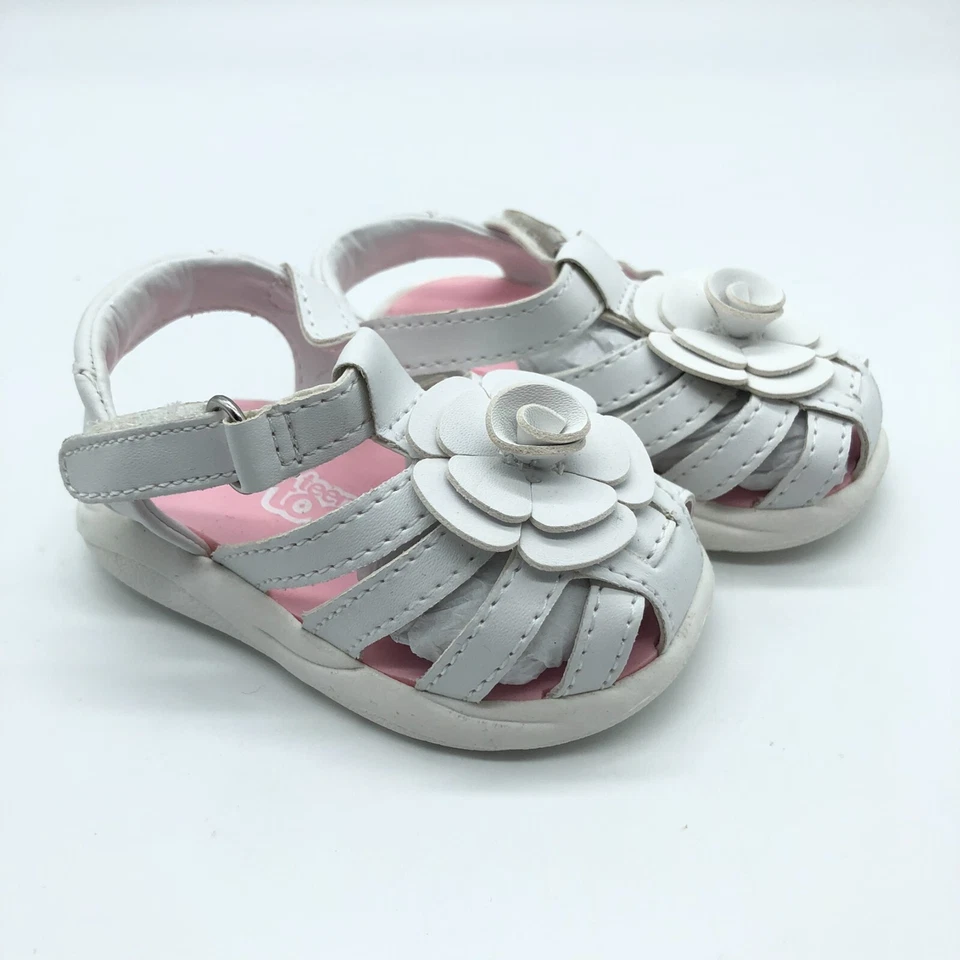 Sandalias Teeny Toes para niñas pequeñas con tiras de cuero sintético apliques florales blancas 2W Foto 1 de 4