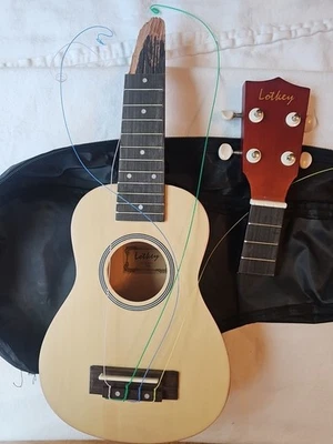 Ukelele soprano arco iris Lotkey paquete para principiantes solo para reparación cuello roto Foto 1 de 4