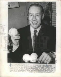 1961 Press Photo Bob Feller gripped baseball in his famed pitching fashion. - Picture 1 of 2