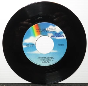 CONWAY TWITTY I MADE YOU A WOMAN/TIGHT FITTIN' JEANS (VG+) MCA-51137 45 RECORD - Picture 1 of 2