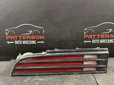 74-78 PONTIAC FIREBIRD LÁMPARA TRASERA IZQUIERDA IZQUIERDA DEL CONDUCTOR CON CARCASA DE BISEL Foto 1 de 4