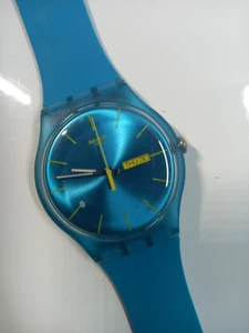 Swatch Watch - SUOL700 - TURQUOISE Rebel Watch VGC In Original Box - Picture 1 of 7