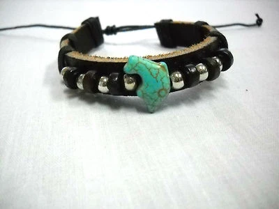 PULSERA ADJ CUERO NEGRO GRUESO con DEFÍN TURQUESA Y MADERA con CUENTAS PLATEADAS Foto 1 de 2