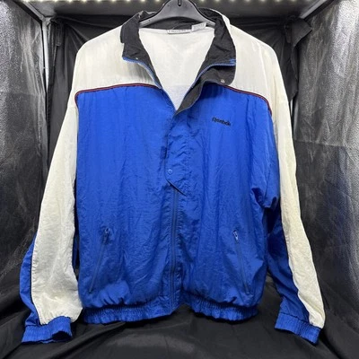 Chaqueta cortavientos vintage Reebok años 90 para hombre talla LG blanca roja azul cremallera completa Foto 1 de 3