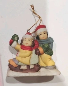 Porcelain Christmas Village Boy Pushing Child In Sled Christmas Ornament - Picture 1 of 7