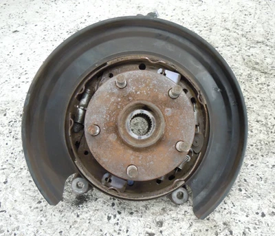 Subaru WRX 2015-2021 husillo trasero nudillo buje conductor izquierdo LH OEM Foto 1 de 2