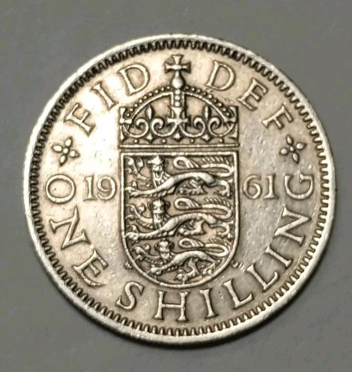 Moneda de 1 chelín británica vintage 1961. No importa cómo se convierta en lo que dice 1961 Foto 1 de 4