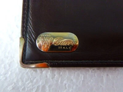 CARTERA PLEGABLE DE CUERO MARRÓN GUCCI DE COLECCIÓN RARA GG ESQUINAS CON LOGOTIPO CHAPADO EN ORO Foto 1 de 4