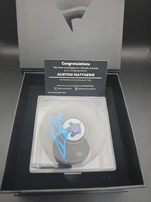 2025 UW Under Wraps Auston Matthews Toronto Maple Leafs Auto Puck Fanatics - Image 1 of 2