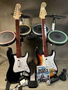 Pacchetto Wii Rock Band/Guitar Hero: batteria, microfono, chitarra e giochi testati - Foto 1 di 21