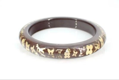 Auténtico Brazalete Louis Vuitton Inclusión Monograma Flor Marrón Transparente Foto 1 de 4