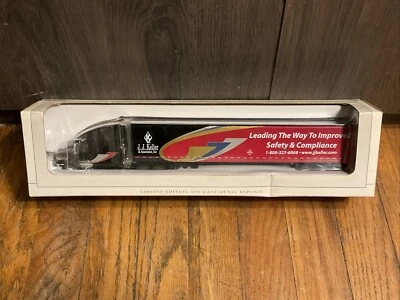 SPECCAST 1/64 BLACK/RED J.J. KELLER VOLVO 770 W/ 53' TRAILER SEMI TRUCK NIB - Image 1 of 4