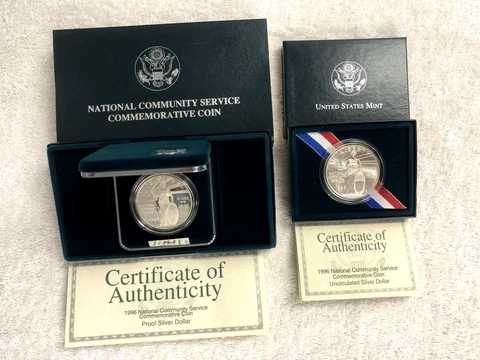 Complete Set (2) of 1996 Community Service Prf/Unc Commemorative Silver Dollars Cover