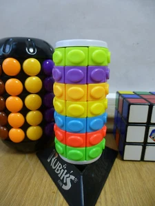 RUBIK’S 7x8 TOWER TWISTER BARREL SLIDE PUZZLE COLOURS CUBE BRAIN TEASER BABYLON - Picture 1 of 3