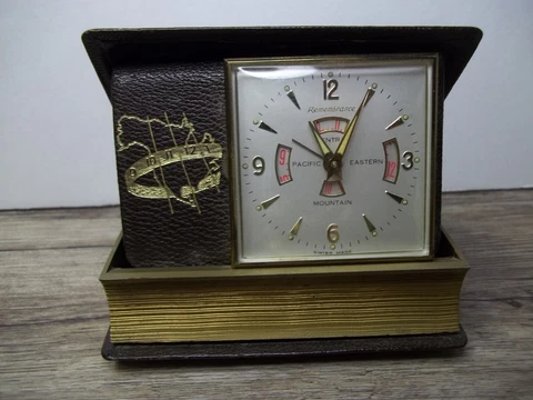 Travel clock in leather case bound like book 4 time zones Swiss made.        Z52 Cover