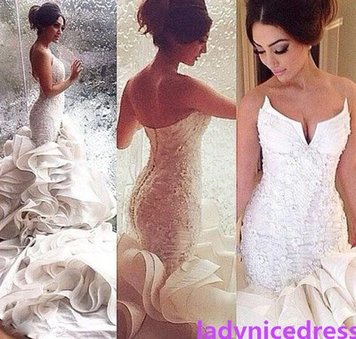 Vestido de novia con apliques de organza tren catedral sirena blanco/marfil Foto 1 de 4