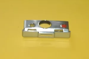 Polaroid Kamera Gehäuseteil Shuttergehäuse funktioniert, gut erhalten silber - Bild 1 von 3