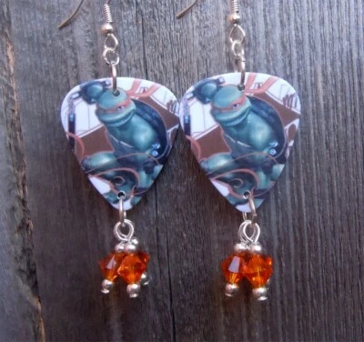Pendientes de selección de guitarra TMNT Miguel Ángel con colgantes de cristal de Swarovski naranja Foto 1 de 4