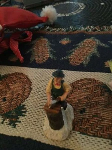 Holiday Figurine :  Man cutting logs on a tree stump : Ceramic - Picture 1 of 2