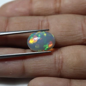 2,5 kt 12,8 x 9,4 mm Natürlicher Multi Auffälliger Feuer Äthiopischer Opal Oval Cabochon - Bild 1 von 6