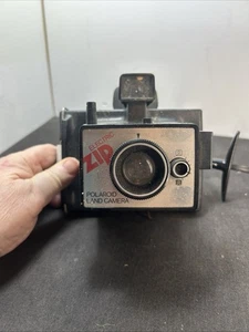 Macchina fotografica terrestre vintage Polaroid elettrica zip nera pellicola istantanea con flash anni '80 - Foto 1 di 4