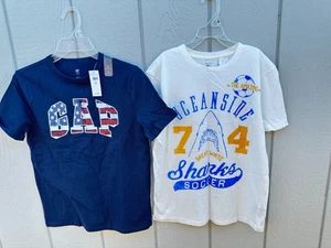 NUEVO 2 Camisetas Gap Oceanside Blanco Talla XL 12 Azul Logo Niños Fútbol - Imagen 1 de 5