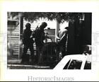 1984 Press Photo S.W.A.T. members shown arresting a suspect - sax25669