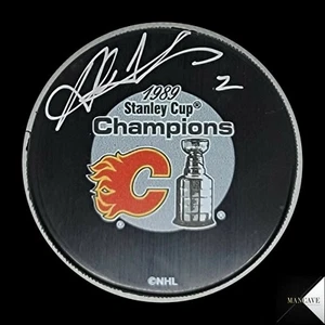 AL MACINNIS SIGNED AUTOGRAPHED CALGARY FLAMES 1989 STANLEY CUP CHAMPIONS PUCK - Picture 1 of 4